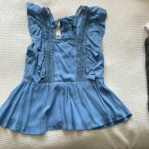 Blue fluttery blouse with low back